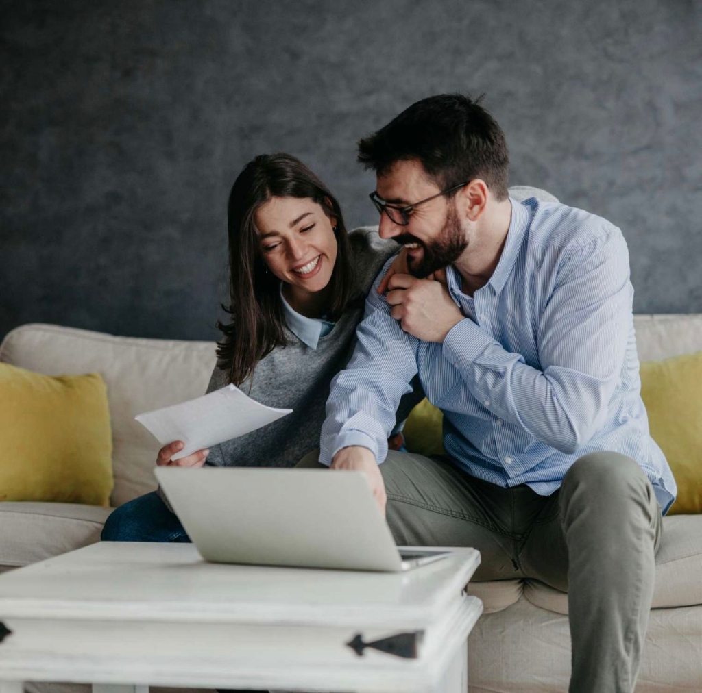 Professional mobile notary consulting with a happy couple during document signing